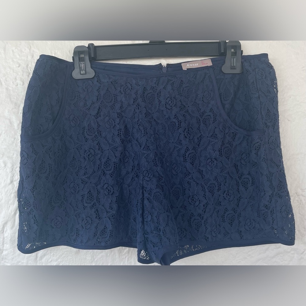 A Wear fully lined navy blue eyelet/lacy shorts with size zip and pockets; 12